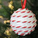 Close up of White Glitter Candy String Bauble on a Christmas tree