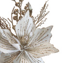 Detailed view of the white velvet magnolia flower with champagne glitter veins, glitter berry centre and shimmering decorative Christmas branch accents.