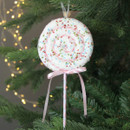 A view of a large pastel lollipop pick on a Christmas tree
