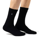 A person wearing a pair of black socks.