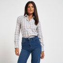 Women’s white checked long-sleeve shirt with blue and pink check pattern, button front and pointed collar, styled with blue jeans.