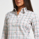 Close-up of women’s white checked shirt showing the pointed collar, button front and blue and pink check pattern.
