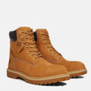 A pair of wheat-colored Timberland PRO work boots with black padded collars and gold eyelets, angled to show the outer sides and front.