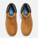 Top-down view of a pair of wheat-colored Timberland PRO work boots showing laces, black padded collars, and blue insole branding.