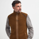Brown sleeveless gilet with a high collar, front zipper, and dark seam accents. The design is sleek and functional, conveying a casual, outdoor vibe.
