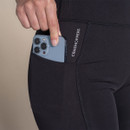 Close-up of Craghoppers leggings side pocket holding a smartphone, with vertical Craghoppers branding.