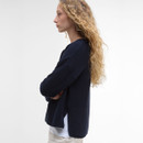 Side view of the navy Barbour Marine jumper showing a relaxed fit, ribbed fabric and split hem.