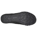 The image shows the textured sole of a black Skechers shoe with a leaf-like tread pattern, designed for grip and durability, conveying functionality.