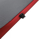 Close-up of a red and grey inflatable mattress corner, showing a black air valve. The sleek design suggests durability and comfort.