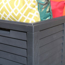 Close-up of the slatted panel design on the corner of a black garden storage box.