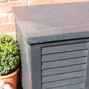 Close-up of the lid and slatted panel detail on a black garden storage box.