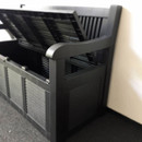 Side view of a black garden storage bench with the lid partially open, showing the hinge mechanism and storage compartment.