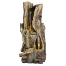 Artificial waterfall resembling a tree trunk, with water cascading over textured wood-like surfaces, surrounded by small stones, creating a serene atmosphere.
