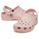 Pink rubber clogs with ventilation holes and a heel strap, set against a white background. Casual, comfortable design with a playful, airy feel.