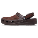 Brown clog with a textured upper, closed toe, strap, and ventilation holes on the sides. The shoe appears comfortable and casual in style. Brown clog with a textured upper, closed toe, strap, and ventilation holes on the sides. The shoe appears comfortable and casual in style.