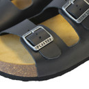 Close-up of black leather sandal straps with adjustable metal buckle detail and cork sole