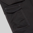 Close-up of cargo pocket on black work trousers with secure flap closure and contrast stitching detail