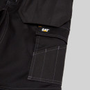 Side leg view of CAT work trousers showing branded label, tool pocket and reinforced panel construction