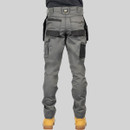 Rear view of grey CAT work trousers with durable fabric, reinforced seat panels and multiple storage pockets