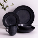 Charcoal grey reactive glaze dinnerware collection featuring matching mug, plates and bowls