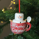 A view of a resin Marshmallow Snowman in a Teacup Hanging Decoration hanging on a Christmas tree