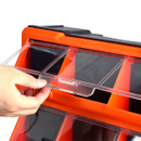 A hand is opening a transparent lid on an orange storage organizer with multiple compartments. The tone is practical and organized.