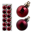 A collection of shiny red Christmas ornaments, featuring a mix of glitter and glossy finishes, displayed on a grey background.