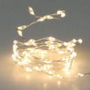 Warm white LED micro string lights on flexible silver wire, providing soft ambient lighting for Christmas trees, table decorations and festive displays.