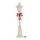 An LED lamp post with a bow on a white background