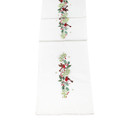 A cream table runner with holly and robin detailing.