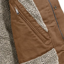 Close-up of the inside of a brown Carhartt jacket showing soft grey sherpa lining and an internal zip pocket stitched into the chest area.