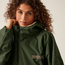 A close up view of a woman wearing a khaki changing robe.