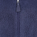 Close-up of a navy blue fleece jacket showcasing a fluffy, textured surface and a visible zip. The cosy fabric conveys warmth and comfort.