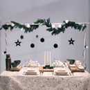 A decorated table stand and laid table
