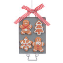 Decorated gingerbread on an oven tray hanging decoration with decorative bow