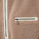 Close-up of a zipper on a brown Barbour Women's Mersea Fleece Overlayer, showcasing its stylish design and quality craftsmanship.