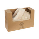 Beige mule slippers packaged in a brown box