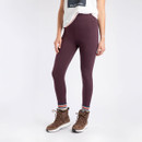 Woman wearing high-waisted wine coloured leggings paired with brown hiking boots and striped socks