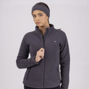 Person in a dark grey fleece jacket with a headband, zipping up the jacket.