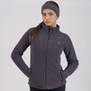 Woman in a dark grey zip-up jacket and headband, with hands on hips.