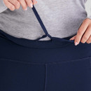 A close-up view of the waist adjuster on a navy pair of Ridgeline women's infinity leggings.