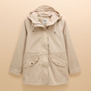 Beige waterproof hooded jacket laid flat, showing front pockets with silver poppers and a clean, minimalist outdoor design.