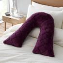 Plush purple body v-shaped cushion with contoured diamond design on a white bedspread.