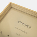 A close up of a medium oak coloured deep frame.