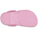 The image shows the pink sole of a sandal, featuring textured tread patterns for grip. The sandal's brand name is visible in the centre.