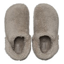 Cosy beige slippers with a fluffy, fleece texture viewed from above, exuding warmth and comfort. They have an inviting, soft appearance.