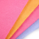 A close up of four multicoloured sponges