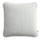 A ivory coloured cushion on a white background