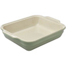 A rectangular sage green ceramic baking dish on a white background.