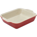 Red ceramic baking dish on a white background.
